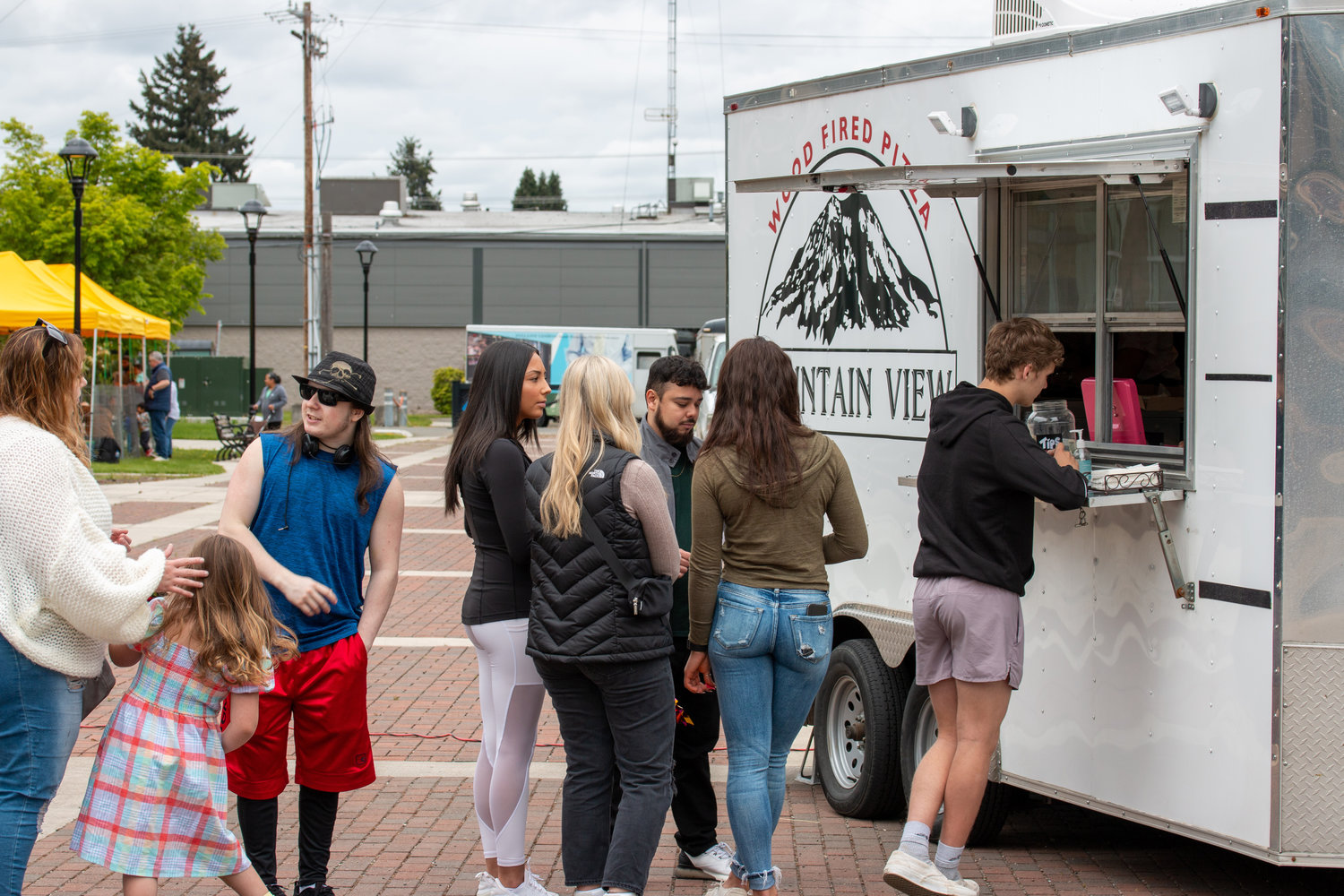 A line forms at the Mountain View pizza truck at the Centralia College SpringFest Tuesday afternoon.